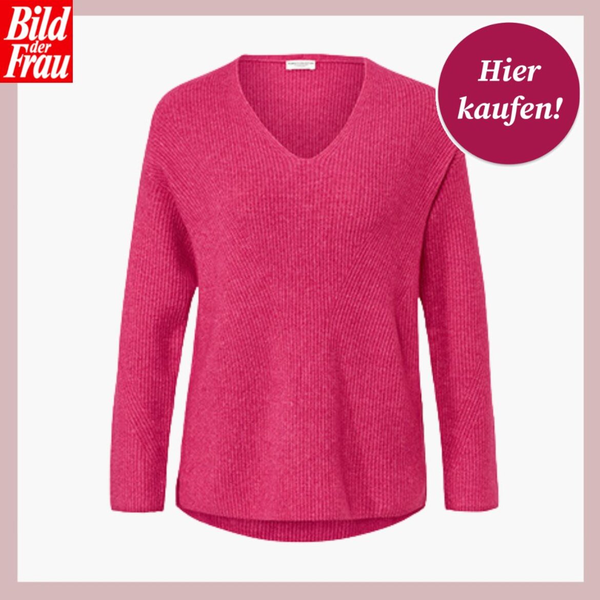 Ein leuchtend pinker Pullover mit V-Ausschnitt und langen Ärmeln vor einem weißen Hintergrund, oben rechts ein "Hier kaufen"-Button. | © Tchibo